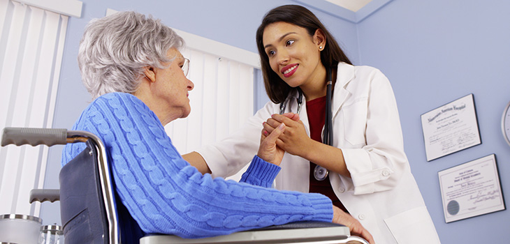 doctor holding a female residents hand