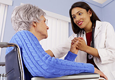 doctor holding a female resident's hand