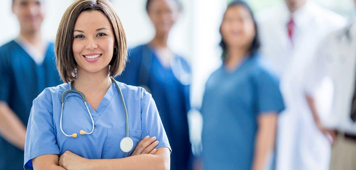Nurses standing together smiling