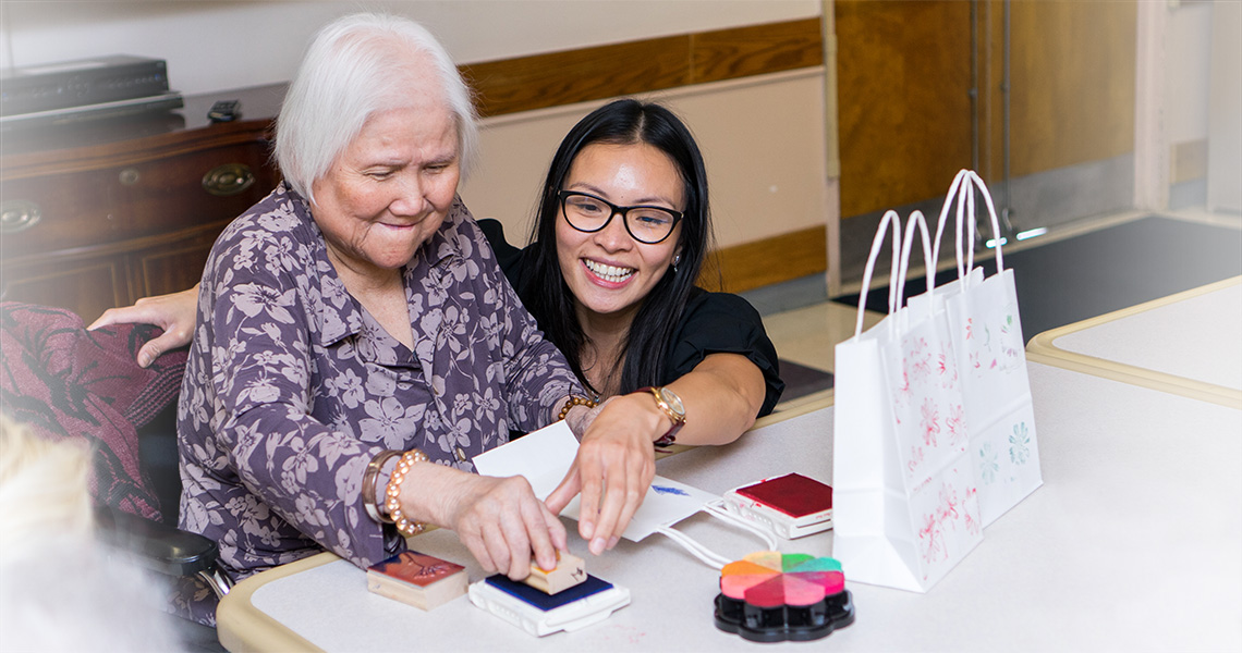 residents making home made gift bags for a craft project